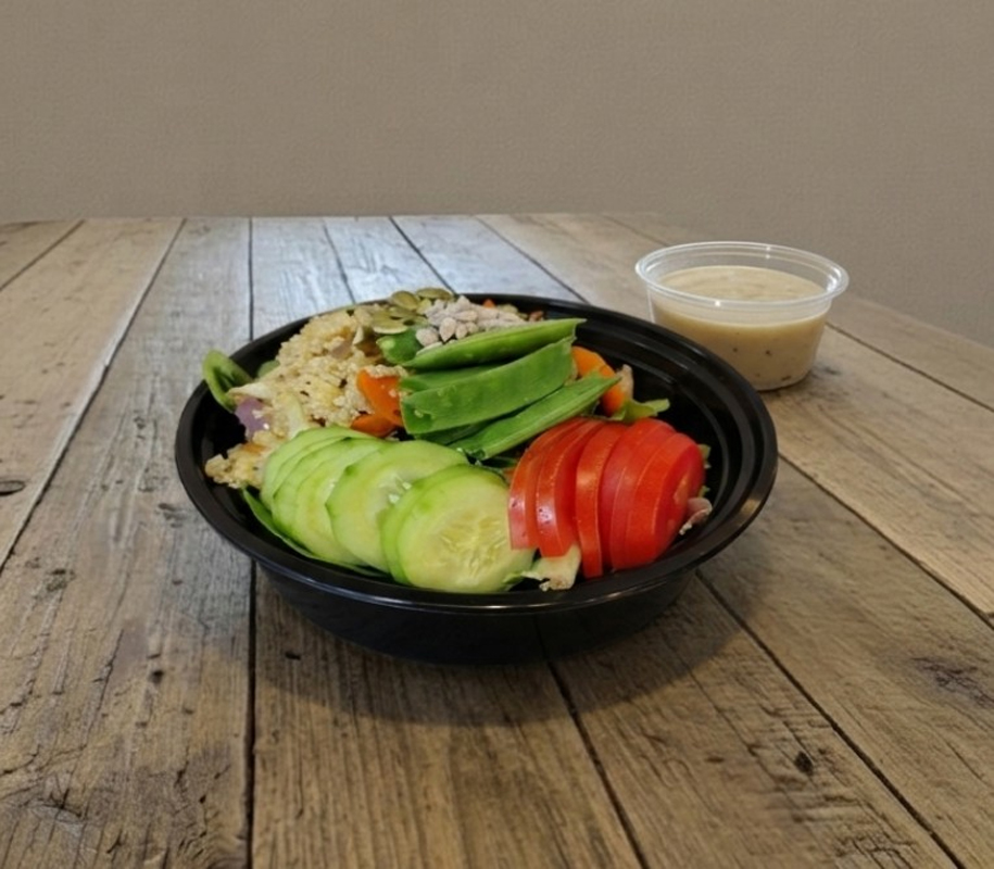 Food on plate with cup of sauce on the side Food on plate with cup of sauce on the side